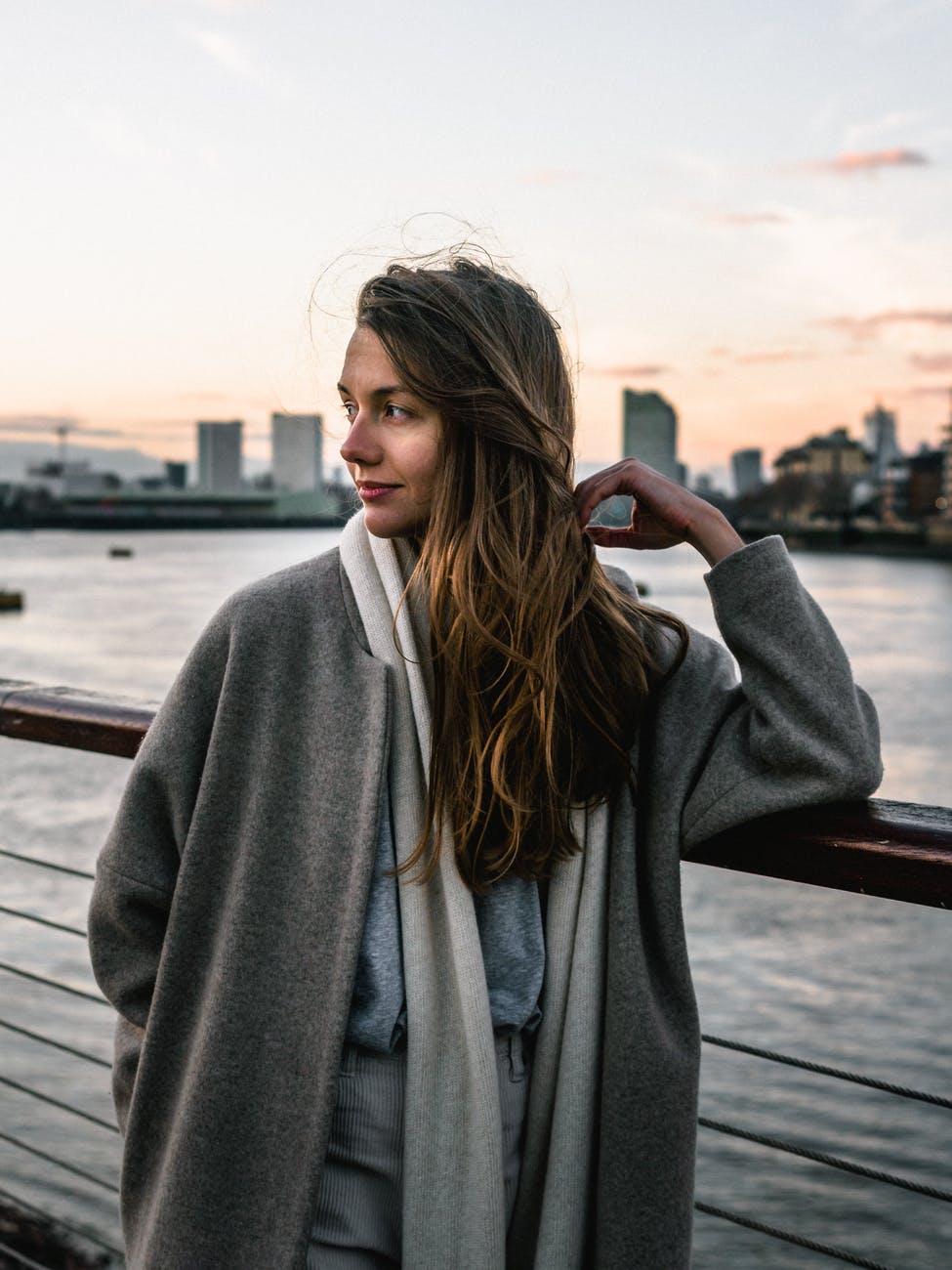 woman leaning on handrail